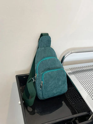 Deep Teal corduroy sling bag with zip pockets and adjustable strap