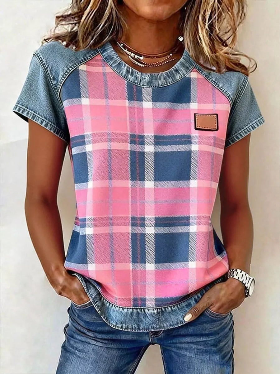 Denim patchwork blouse with pink and blue plaid front, short sleeves, and crew neck.
