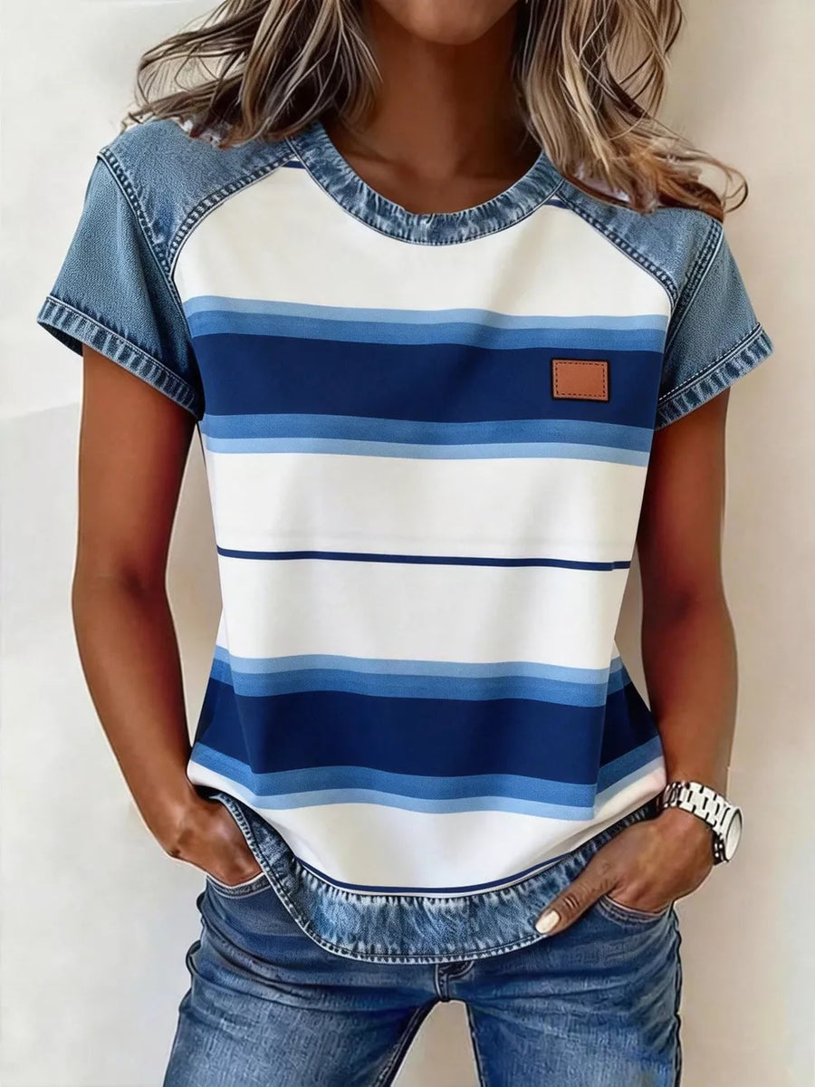 Denim patchwork blouse with blue and white stripes, short sleeves, and a round neckline.