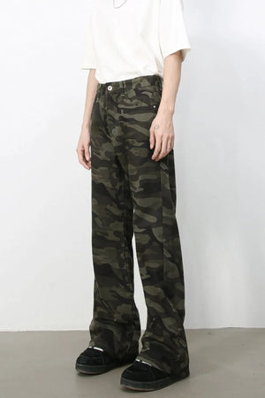 Camo flare denim trousers in green camouflage pattern, featuring a casual, breathable fit.