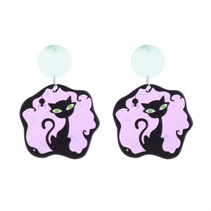 Spooky black cat dangle earrings with pink background and stars