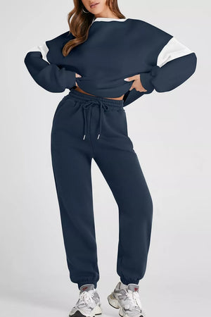 Navy oversized active set sweatshirt with white sleeves and matching drawstring sweatpants.