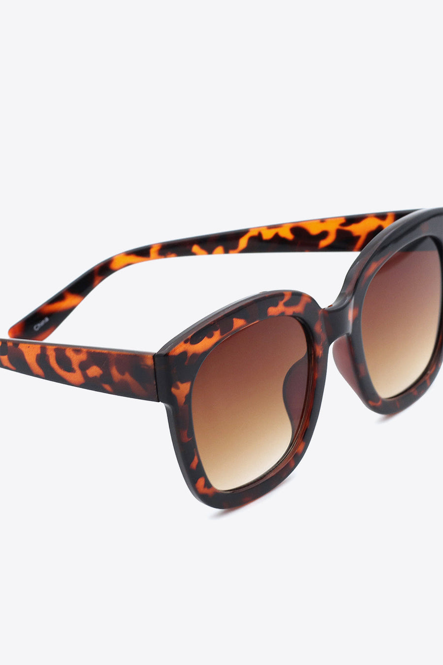 Tortoiseshell gradient square sunglasses with brown lenses and thick frames.