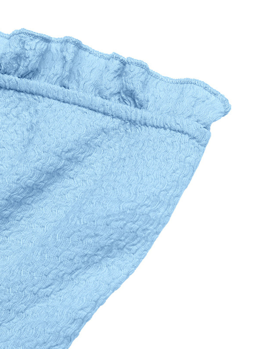 Light blue smocked frill tube top with textured fabric and a buckle detail.