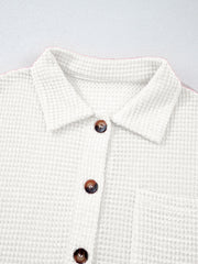 White waffle knit button-up shirt with chest pocket and brown buttons.