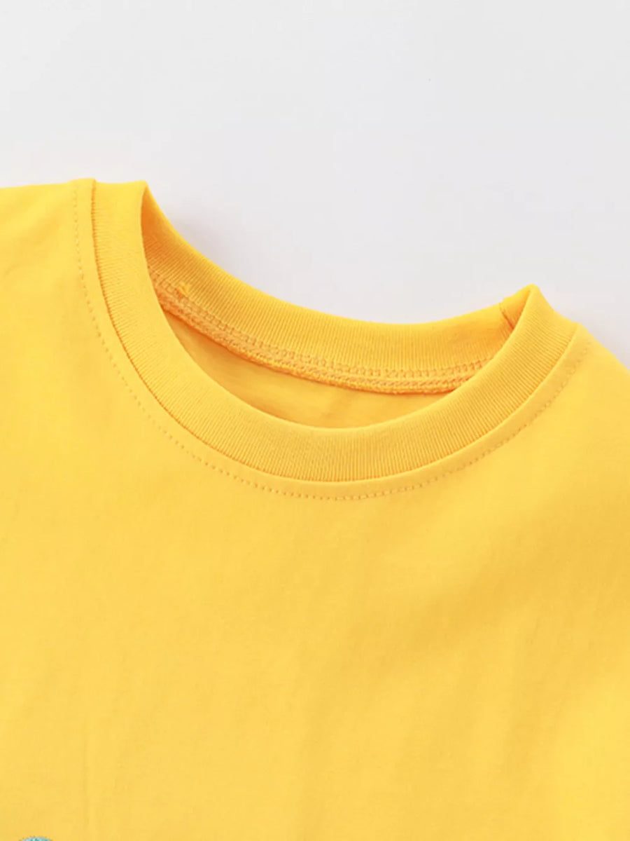 Yellow cotton toddler tee with crew neck and crocodile appliqué detail.