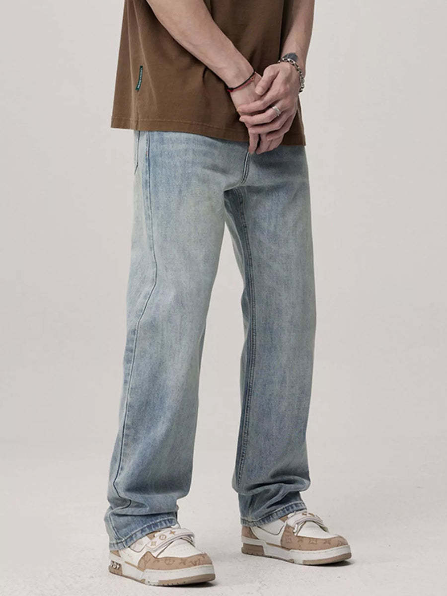 Men's light blue relaxed fit wash jeans with a casual, everyday style.