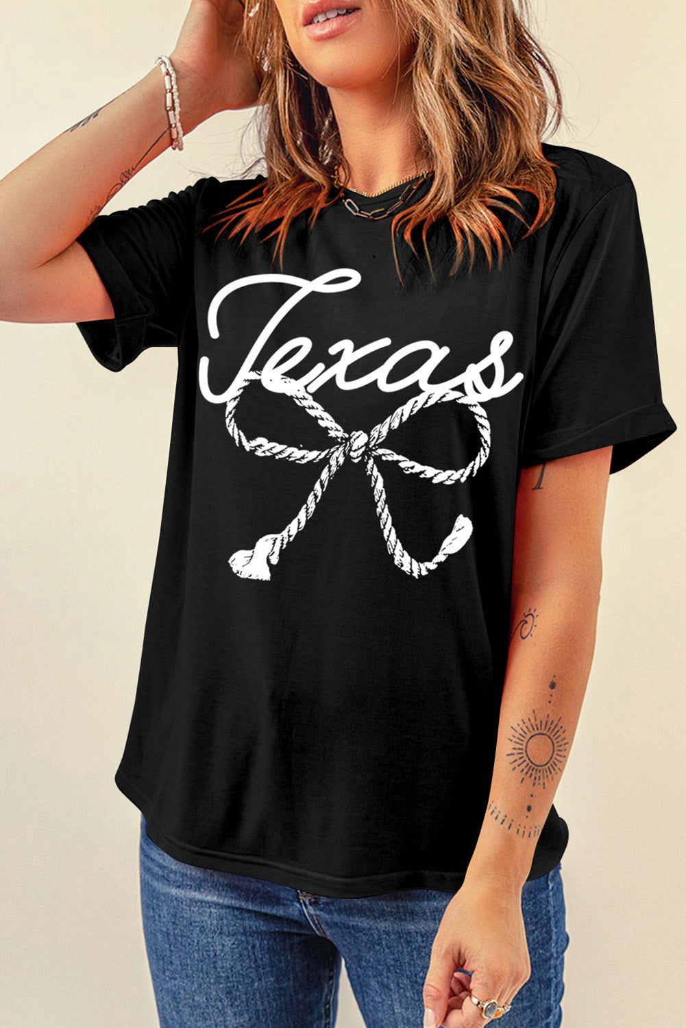 Black graphic tee with white Texas rope knot design