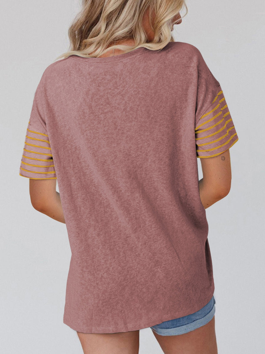 Loose fit dusty pink t-shirt with yellow striped sleeves and a crew neck.
