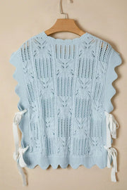 Light blue openwork cable-knit cardigan with cap sleeves and tie details