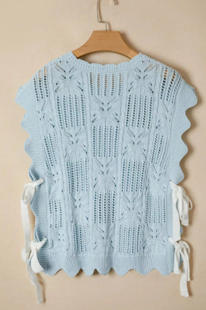 Light blue openwork cable-knit cardigan with cap sleeves and tie details