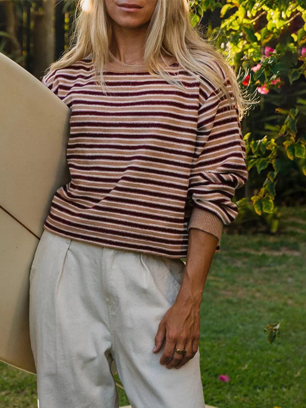 100% polyester Care instructions: Machine wash cold pullover sweater in white with relaxed silhouette