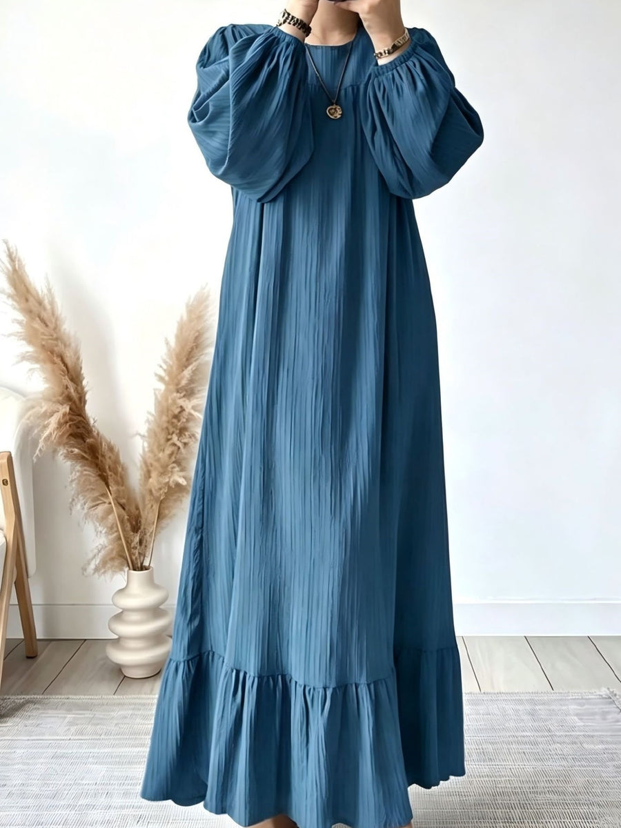 maxi dress in teal blue featuring ruffled and relaxed fit