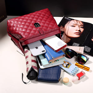 Red handbag featuring quilted and quilted