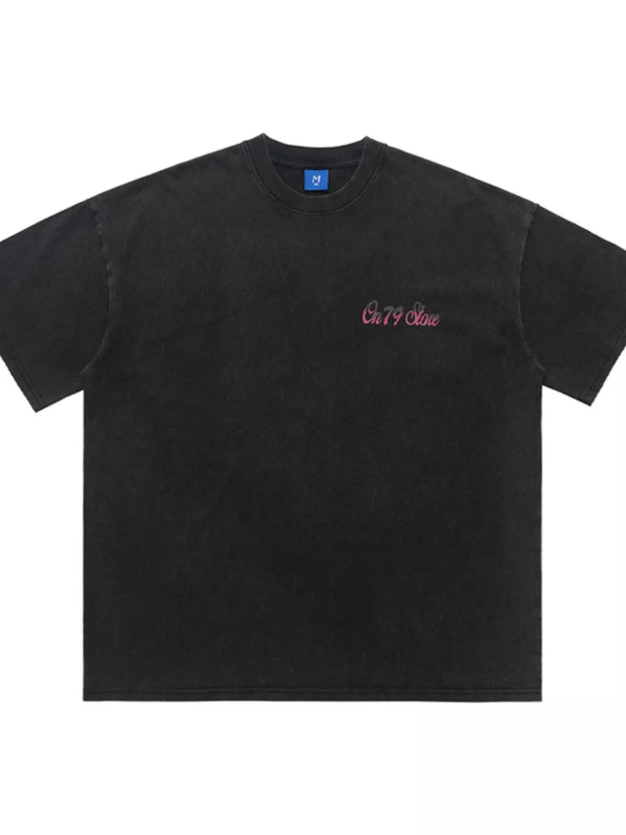 Black cotton t-shirt with pink retro graphic and crew neck.