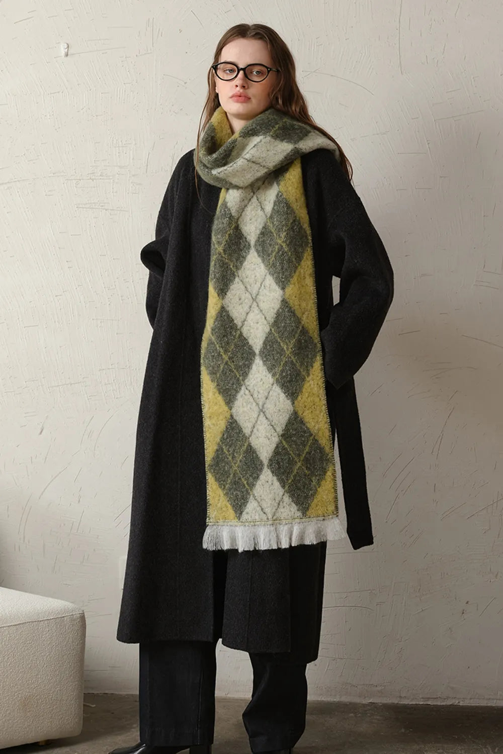 Argyle knit scarf with fringe in moss and yellow, featuring a diamond pattern.