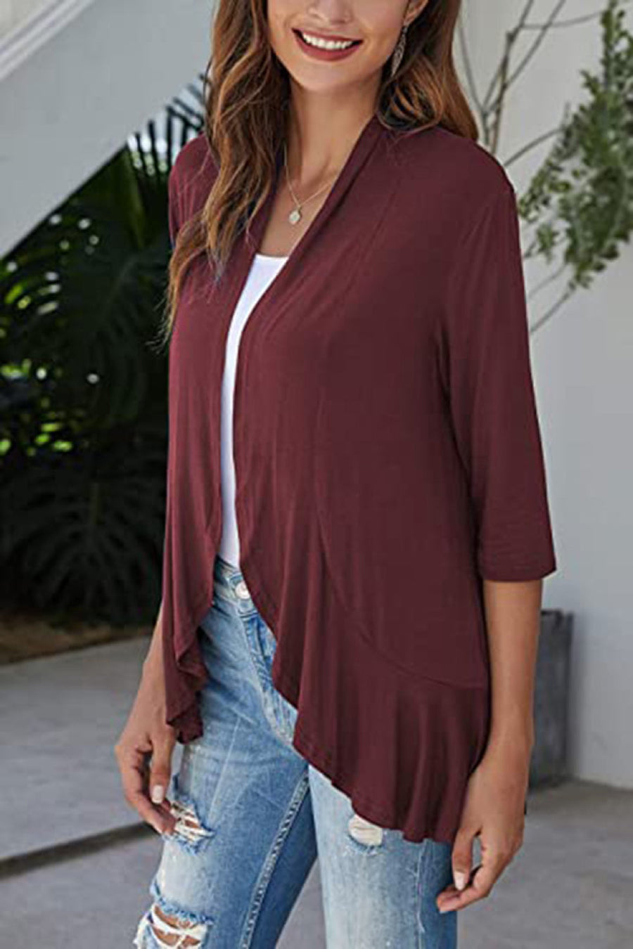 Burgundy waterfall cardigan with asymmetric hemline and 3/4 sleeves.