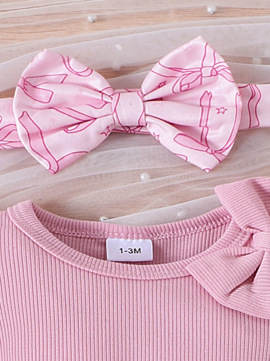 Pink ribbed cotton baby bodysuit with bow detail and matching bowknot headband.
