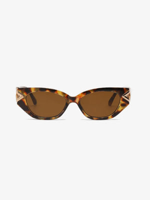 Geometric cat-eye sunglasses in tortoiseshell with gold accents and brown lenses.