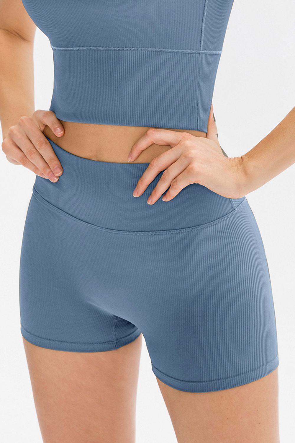 Light blue ribbed sculpting active shorts with high waist and seamless design.