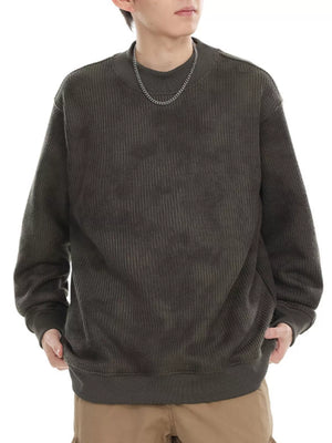 Dark gray oversized corduroy sweatshirt with mock neck and ribbed cuffs and hem.