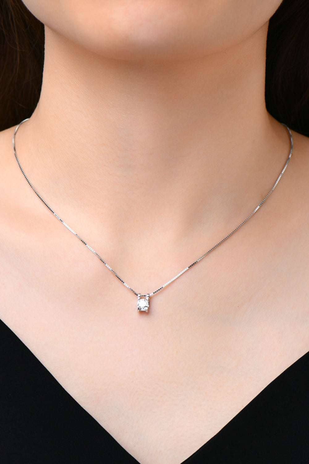 Silver cubic zirconia pendant necklace with a delicate box chain.