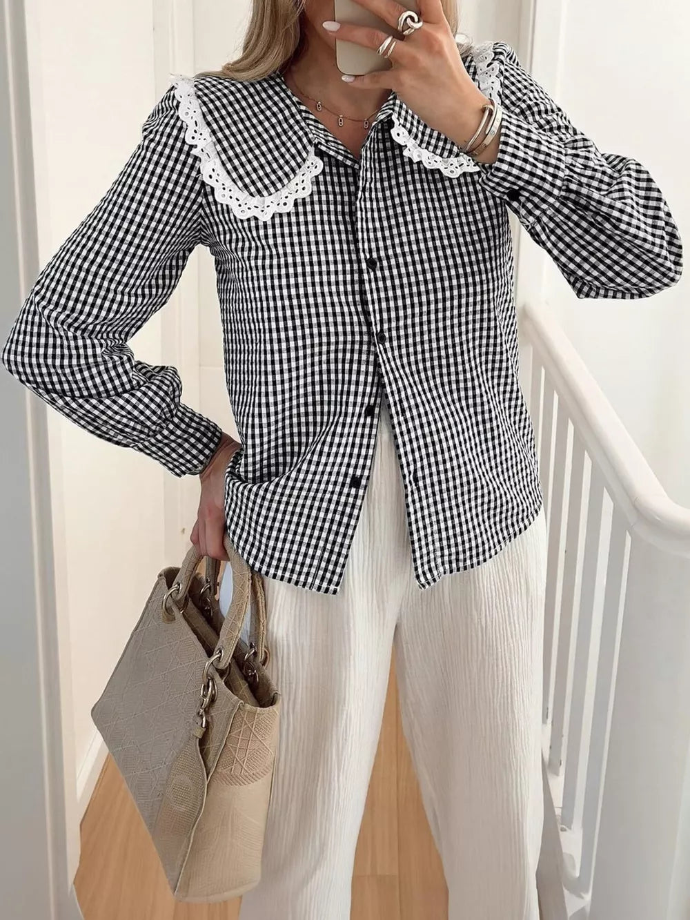 black button-up shirt with gingham and peter pan collar