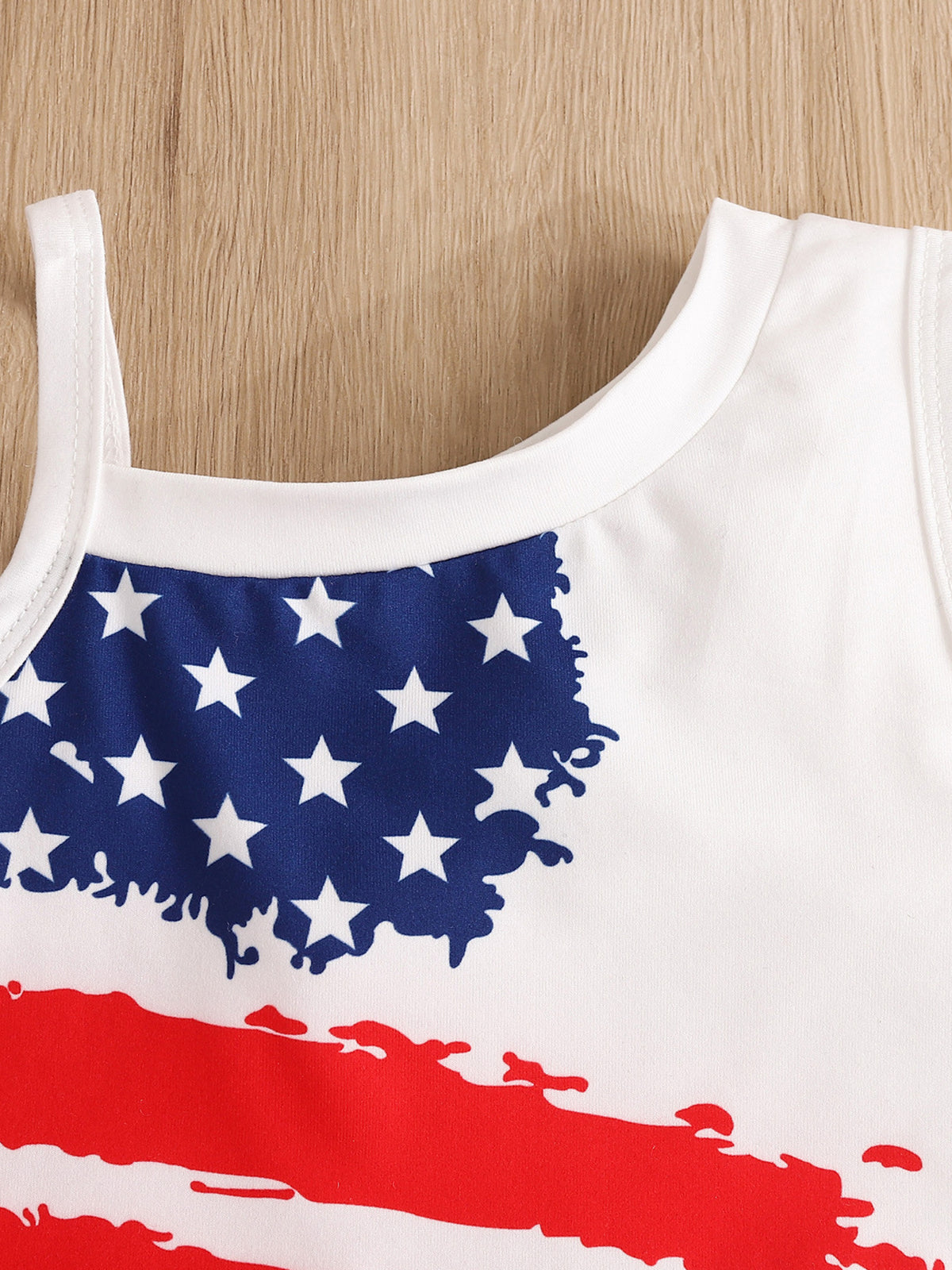 Baby tank top with distressed American flag print, white cotton.