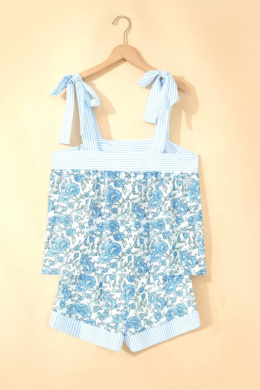 Floral print cami top and shorts set with adjustable tie straps and blue stripes.