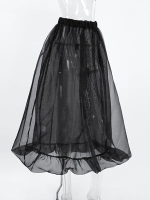 Black midi skirt with sheer overlay and ruffled hem