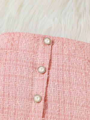 Pink tweed skirt set detail with pearl buttons