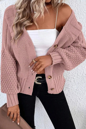 52% viscose, 26% polyester, 22% polyamide Care instructions: Machine wash cold cardigan in blush pink with relaxed silhouette
