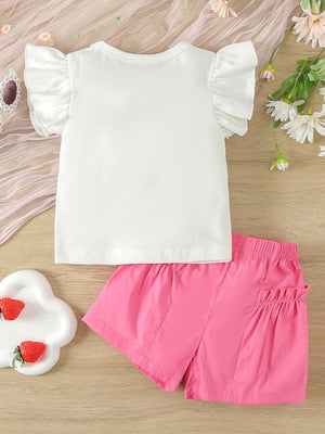 Baby girl outfit with white ruffle sleeve top and bright pink shorts with ruffled pockets.