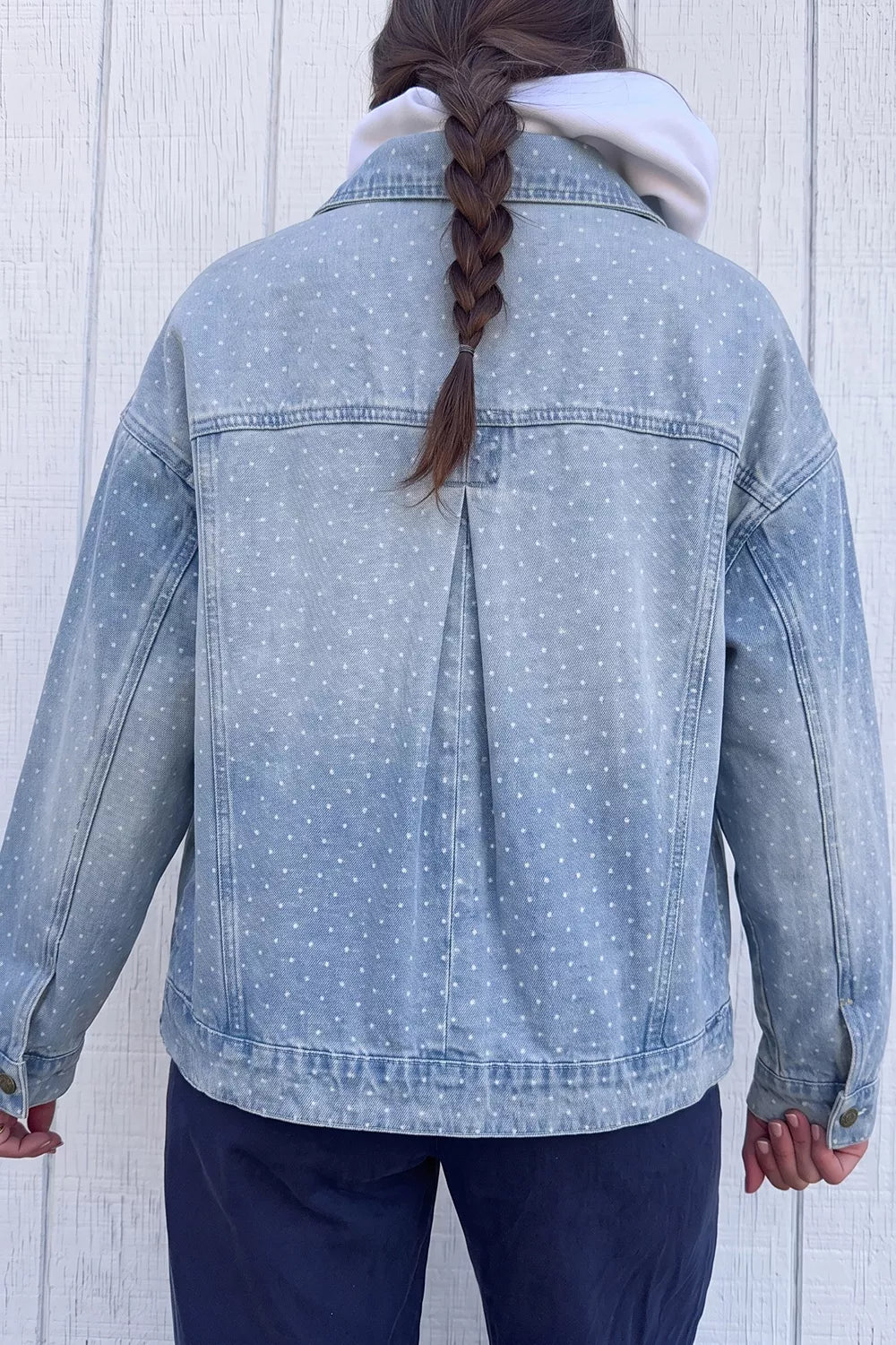 white denim jacket featuring buttoned and polka dot