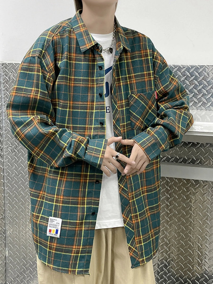 Green plaid long-sleeve button-up shirt with orange and yellow accents.