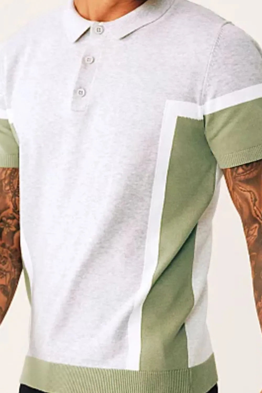 Geometric panel knit polo shirt in matcha green with buttoned neckline and short sleeves.