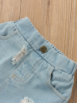 Light wash distressed denim skirt with button detail and frayed hem.