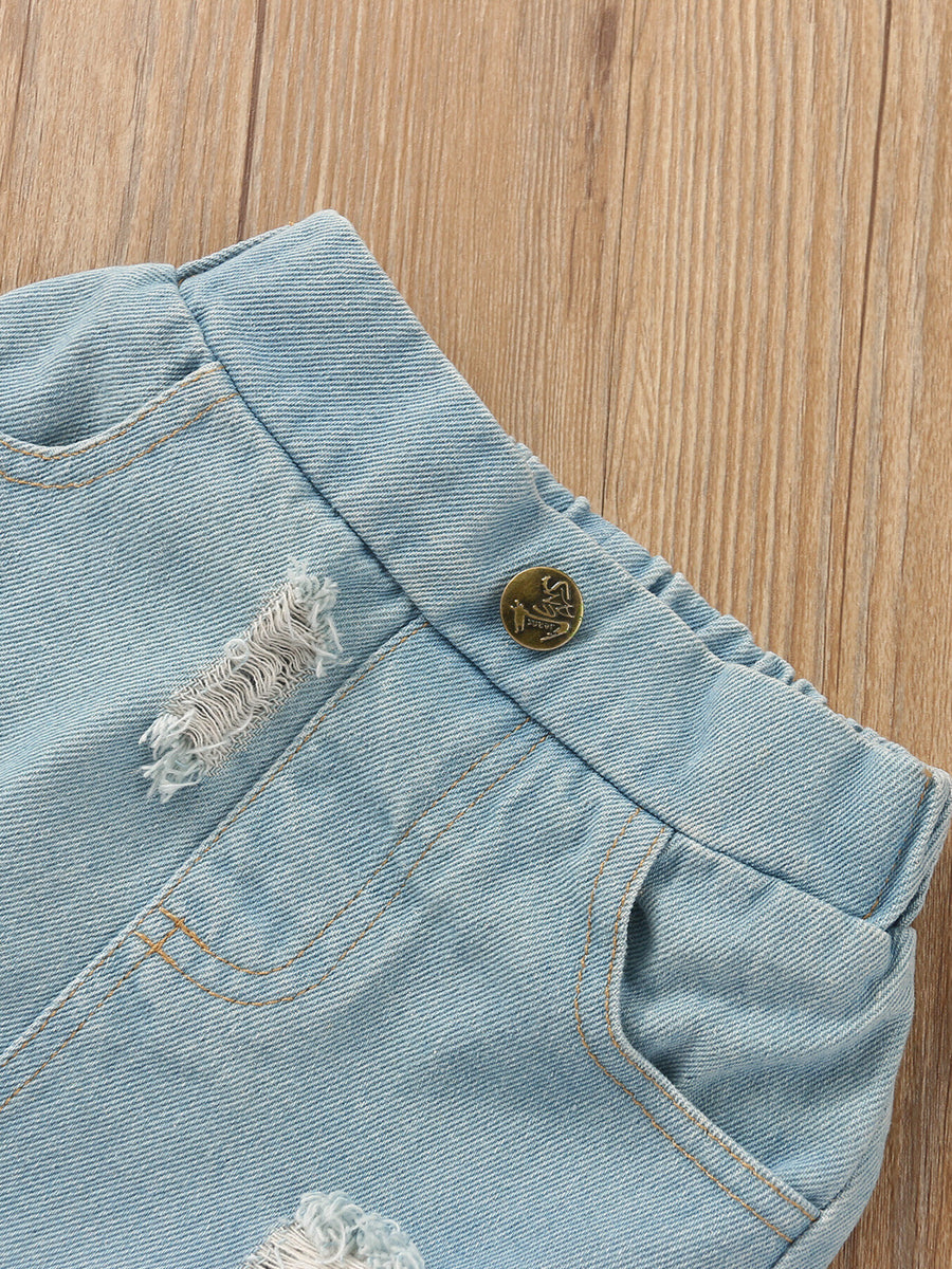 Light wash distressed denim skirt with button detail and frayed hem.