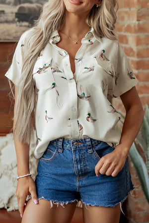 green button-up shirt featuring button-front and animal-print