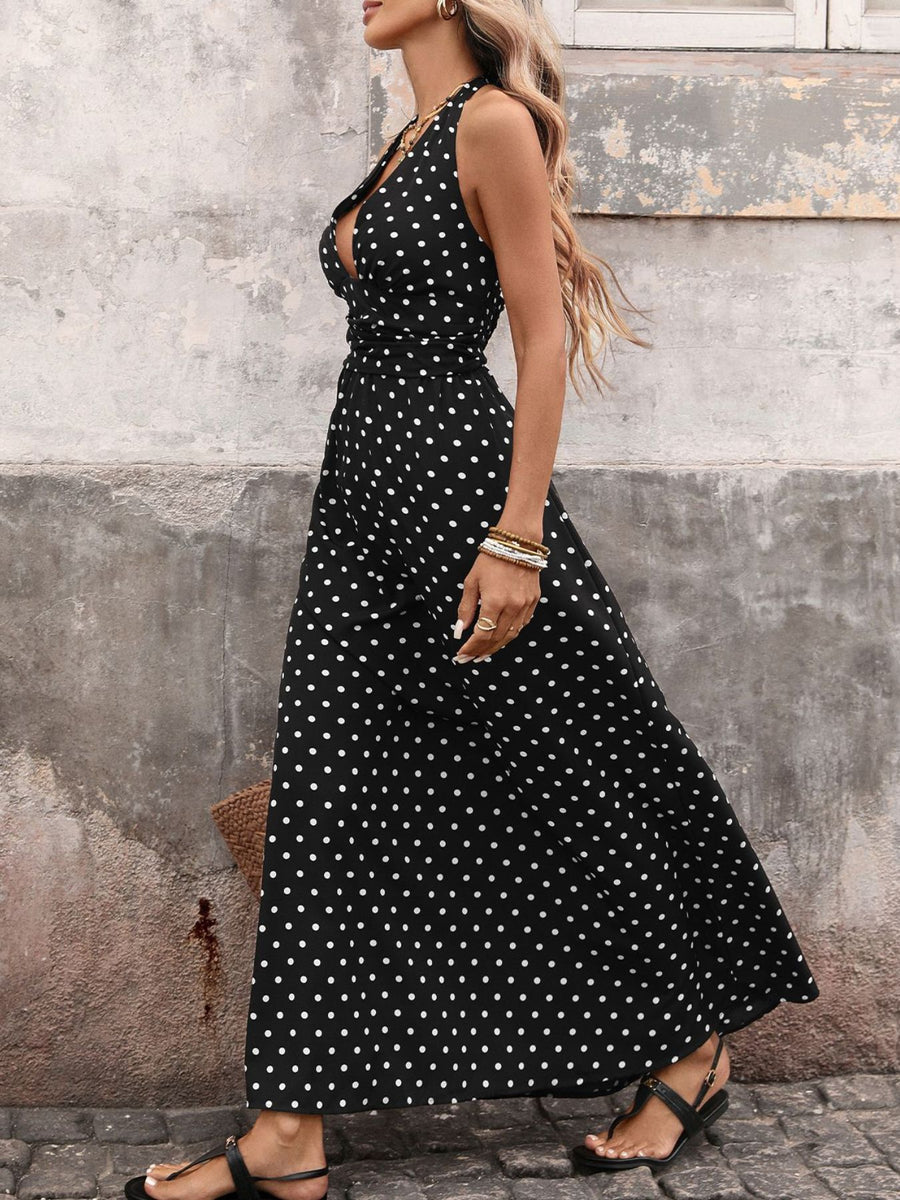 Black polka dot maxi dress with halter neck and cinched waist