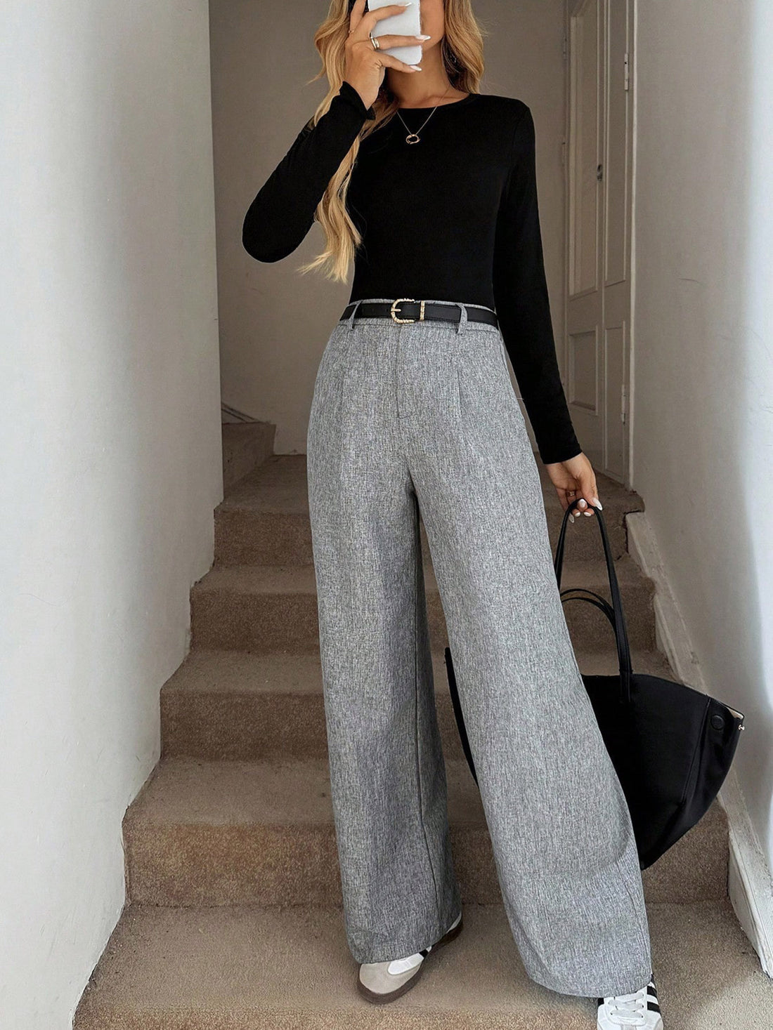 wide-leg pants in light gray featuring high-waisted and wide-leg fit