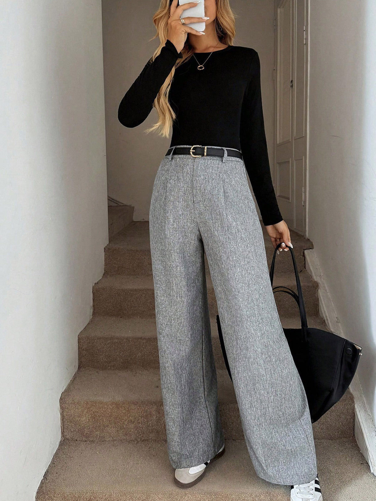 wide-leg pants in light gray featuring high-waisted and wide-leg fit