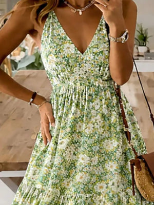 Floral tiered maxi dress with spaghetti straps in Yellow-Green, featuring a V-neck and ruffled hem.