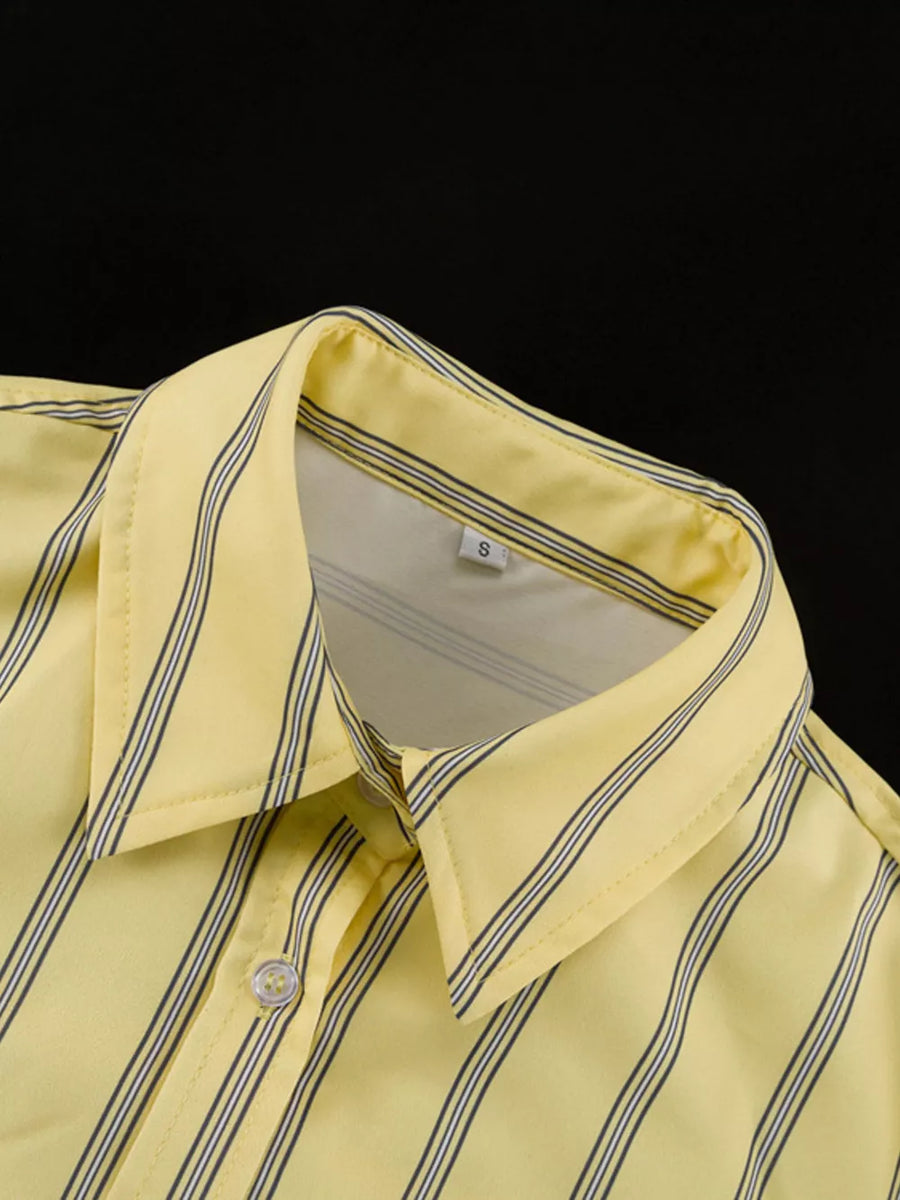 Yellow striped button-up shirt with a pointed collar and button closure.