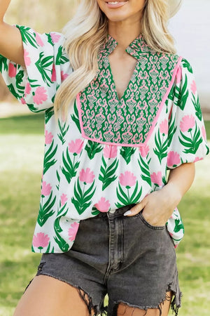 Playful floral v-neck blouse with puff sleeves and green patterned yoke