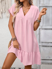 Pink V-neck mini dress with short sleeves and a ruffled hem.