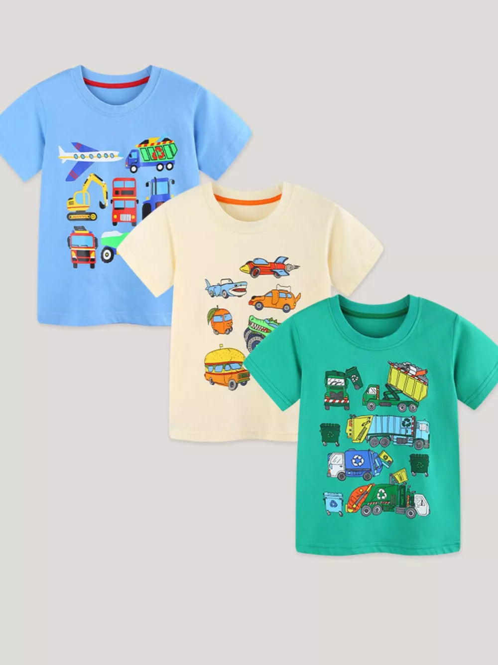 Toddler short sleeve cotton t-shirts in blue, cream, and green with vehicle prints.