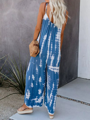 Blue tie-dye wide-leg jumpsuit with spaghetti straps and a v-neck