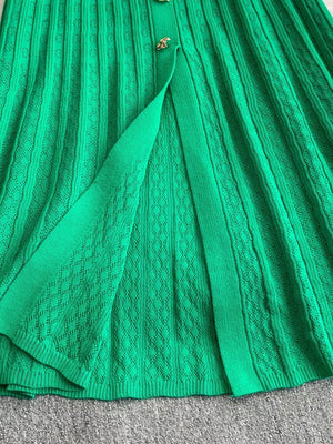 Green ribbed knit midi dress with button detail and open front slit.