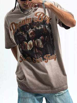 Khaki graphic t-shirt with puff sleeves and a "Dream Boy Faith Over Fear" print.